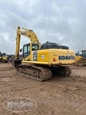 Used Excavator under blue sky